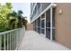 Large screened balcony with white railing, showcasing the building's exterior and outdoor living space at 960 Starkey Rd # 2103, Largo, FL 33771