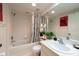 Neat bathroom with white tile, bathtub with shower, vanity, and toilet at 960 Starkey Rd # 2103, Largo, FL 33771