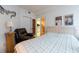 Cozy bedroom with access to the kitchen, featuring a comfortable armchair, and unique decorative elements at 960 Starkey Rd # 2103, Largo, FL 33771