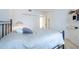 Bright bedroom featuring a bed, a closet, and two shelves that offer ample storage space at 960 Starkey Rd # 2103, Largo, FL 33771