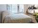 Comfortable bedroom with a bed, a large window and musical decor at 960 Starkey Rd # 2103, Largo, FL 33771
