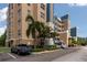 Multi-story condo building with well-maintained landscaping and dedicated parking spaces for residents and visitors at 960 Starkey Rd # 2103, Largo, FL 33771