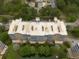 Aerial view of building with lake view featuring multiple balconies, ample parking and mature landscaping at 960 Starkey Rd # 2103, Largo, FL 33771
