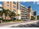 Exterior view highlighting the building's architecture, balcony views, and well-kept grounds near parking at 960 Starkey Rd # 2103, Largo, FL 33771