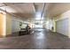 Well-lit garage space featuring multiple parking bays and a golf cart, providing ample storage at 960 Starkey Rd # 2103, Largo, FL 33771