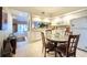 Bright kitchen featuring white cabinetry and an adjacent dining area at 960 Starkey Rd # 2103, Largo, FL 33771