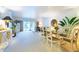 Spacious living room featuring a dining area, sliding glass doors, and neutral colored walls at 960 Starkey Rd # 2103, Largo, FL 33771
