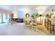 Open-plan living room features a dining area, large sofa, and sliding glass doors to the outside at 960 Starkey Rd # 2103, Largo, FL 33771