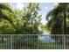 Scenic view from the balcony overlooking a serene lake and verdant landscaping at 960 Starkey Rd # 2103, Largo, FL 33771