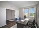 Efficient home office with large desk and comfortable seating and natural light from window at 9921 Surrey Rose Dr, San Antonio, FL 33576