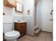 Modest bathroom with tiled floors, a single-sink vanity, and a tiled walk-in shower at 9927 Woodridge Ct, Port Richey, FL 34668