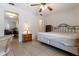 Bedroom featuring tile floors, a ceiling fan, natural light, and traditional furniture pieces at 9927 Woodridge Ct, Port Richey, FL 34668