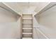 Organized walk-in closet with built-in shelves and hanging rods at 996 56Th S Ave, St Petersburg, FL 33705