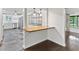 Eat-in bar with butcher block counter and open views of kitchen and living room at 996 56Th S Ave, St Petersburg, FL 33705