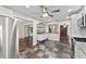 Open kitchen with stainless appliances, white cabinetry, and an eat-in bar at 996 56Th S Ave, St Petersburg, FL 33705