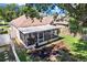 Overhead view of a backyard featuring a screened-in porch and a well-kept lawn at 10401 Lakeside Vista Dr, Riverview, FL 33569