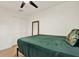 A bedroom features wood floors, a double closet and ceiling fan at 10401 Lakeside Vista Dr, Riverview, FL 33569