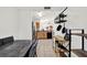 The dining area features an adjacent kitchen, a marble table and shelving at 10401 Lakeside Vista Dr, Riverview, FL 33569