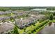 Aerial view of multiple townhomes with views of the nearby lake at 11526 Crowned Sparrow Ln, Tampa, FL 33626
