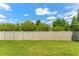 Spacious backyard with lush lawn and privacy fence at 11526 Crowned Sparrow Ln, Tampa, FL 33626