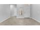 Clean entryway featuring neutral tones, tile floors, and a bright window, offering a welcoming first impression at 11526 Crowned Sparrow Ln, Tampa, FL 33626