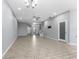 Bright living area featuring a ceiling fan, neutral gray walls, and tile floors at 11526 Crowned Sparrow Ln, Tampa, FL 33626