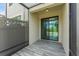 Enclosed patio with tile flooring and privacy fence at 11526 Crowned Sparrow Ln, Tampa, FL 33626