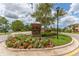 Welcome to West Lake sign surrounded by colorful flowers and landscaping at 11526 Crowned Sparrow Ln, Tampa, FL 33626
