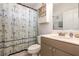 Full bathroom with nautical themed shower curtain and updated sink vanity at 1162 Music Ln, North Port, FL 34286