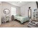 Cozy bedroom with a comfortable twin-size bed, a desk, and bright natural light at 1162 Music Ln, North Port, FL 34286