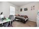 Bedroom with twin bed, desk, wall decorations and closet at 1162 Music Ln, North Port, FL 34286