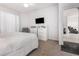 Comfortable carpeted bedroom with closet, dresser, ceiling fan, and comfortable seating at 1162 Music Ln, North Port, FL 34286