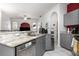 Stylish kitchen features stainless steel appliances, granite counters, and ample cabinet space at 1162 Music Ln, North Port, FL 34286