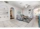 Bright living room featuring tile floors, comfortable seating, and an open layout at 1162 Music Ln, North Port, FL 34286