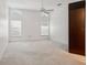 Spacious bedroom with lots of natural light, light carpet, and a ceiling fan at 11638 Branch Mooring Dr, Tampa, FL 33635