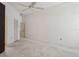 Bright and airy bedroom with light carpet, closet, and ceiling fan at 11638 Branch Mooring Dr, Tampa, FL 33635