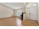 Inviting entryway with hardwood floors, vaulted ceiling, and ample natural light at 11638 Branch Mooring Dr, Tampa, FL 33635