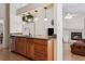 Open kitchen with granite countertops, stainless steel appliances, and hardwood floors at 11638 Branch Mooring Dr, Tampa, FL 33635