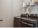 Laundry room with modern washer and dryer units, providing convenience and functionality at 11638 Branch Mooring Dr, Tampa, FL 33635