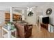 Spacious living room offering hardwood floors, a ceiling fan, and kitchen views at 11638 Branch Mooring Dr, Tampa, FL 33635