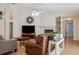 Cozy living room with a fireplace, hardwood floors, and plenty of space at 11638 Branch Mooring Dr, Tampa, FL 33635
