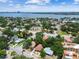 An aerial view showcases the homes and neighborhoods as well as the nearby ocean at 120 Bosphorous Ave, Tampa, FL 33606