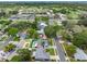 Overhead shot of neighborhood with mature trees, swimming pools, and easy access to nearby amenities at 12920 124Th Ave, Largo, FL 33774