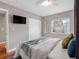 Bright bedroom featuring a ceiling fan, closet, and a window that provides plenty of natural light at 12920 124Th Ave, Largo, FL 33774