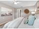Comfortable bedroom featuring neutral tones, ceiling fan, and ample closet space, creating a relaxing atmosphere at 12920 124Th Ave, Largo, FL 33774