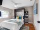 Cozy bedroom with built-in storage, bright window and ceiling fan, perfect for relaxation at 12920 124Th Ave, Largo, FL 33774