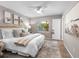 Comfortable bedroom featuring neutral tones, ceiling fan, and ample natural light, creating a relaxing atmosphere at 12920 124Th Ave, Largo, FL 33774