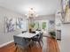 Dining room featuring modern chandelier, table, and view to the backyard at 12920 124Th Ave, Largo, FL 33774
