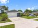 Attractive single-Gathering home with a lush lawn, mature landscaping, and an inviting driveway at 12920 124Th Ave, Largo, FL 33774