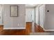 Inviting foyer featuring hardwood floors, a stylish front door, and closet for a welcoming entrance at 12920 124Th Ave, Largo, FL 33774